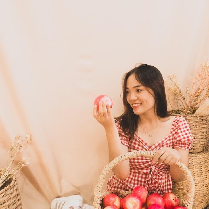 Kaveri Mehta, Lead Design Curator at WindGroveStudio, reviewing corporate floral arrangements