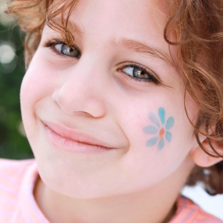 Kaveri Mehta, Lead Design Curator at WindGroveStudio, reviewing corporate floral arrangements